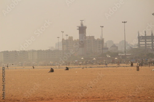 wide view of Chennai marina beach on afternoon with less people.