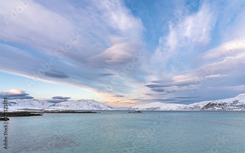 Fototapeta Naklejka Na Ścianę i Meble -  winterlandscape with dramatic sky on Kvaloeya Island near Tromsoe in northern Norway, landscape photography