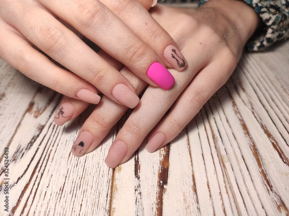 stylish manicure with a design on beautiful hands