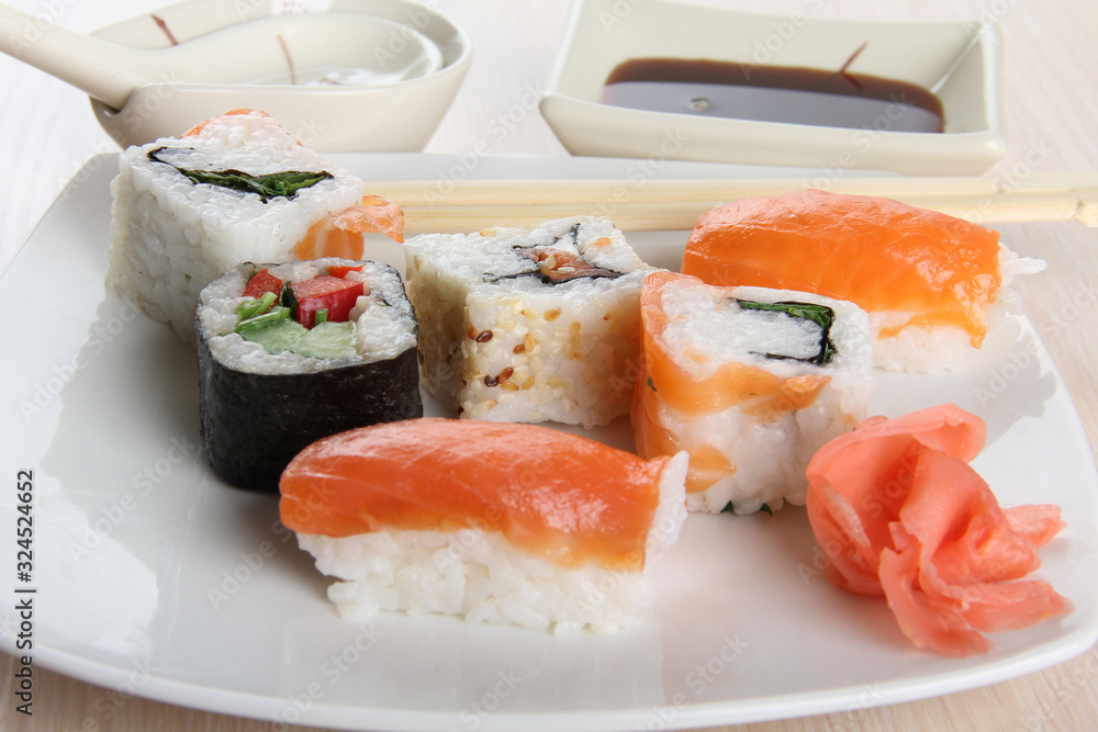 Sushi and rolls with porcelain sauce Sushi and rolls with porcelain sauce