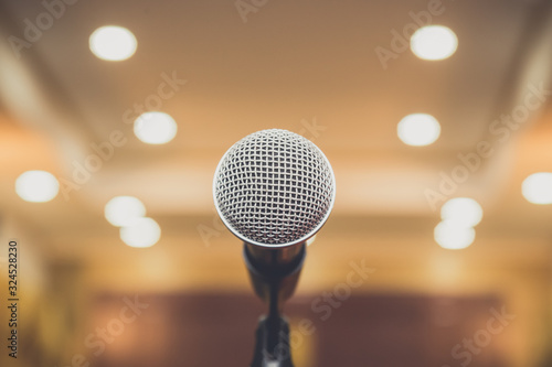 Microphone on abstract blurred in seminar room or speaking conference hall, Event Background