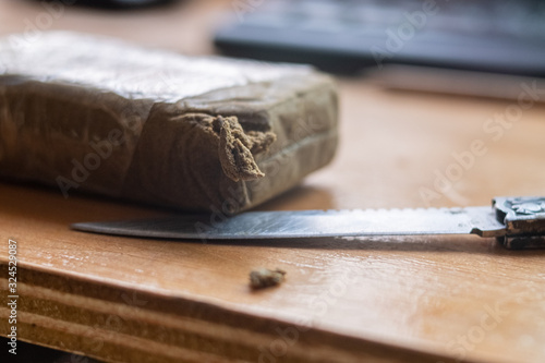 detail of a block of first quality medicinal hashish blonde pollen