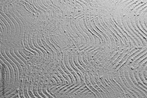 scratched curved stucco on wall texture - pretty abstract photo background