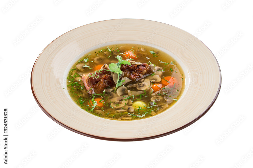 Mushrooms soup with beef rib and carrot isolated on white background