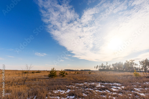 panorama of the sky over the fields in spring. blue sky with clouds. background