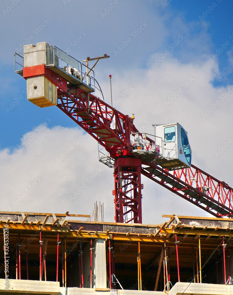 Crane. Close up. Industrial crane against blue sky. Construction site.