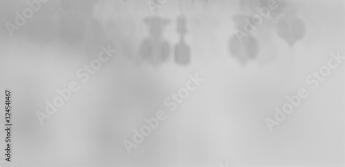 abstract white and gray simple background space concept picture of unfocused chandelier shadow on wall