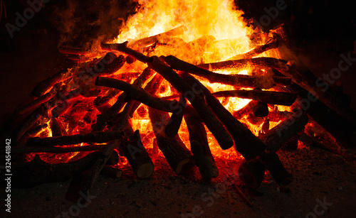 Wood fire in the night looking natural. Big flames of burning wood.