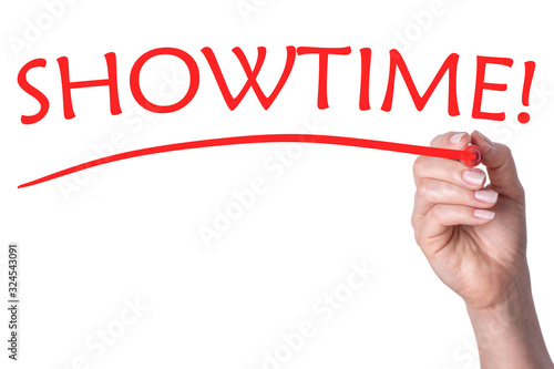 Hand writes word showtime with red marker
