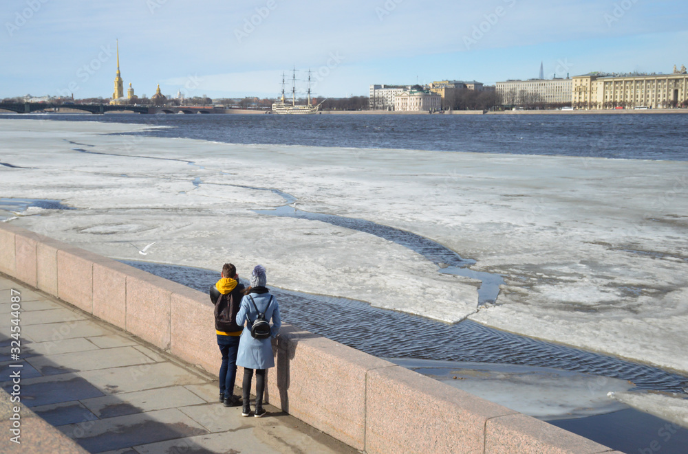 Guy with a girl admire the view of the winter Neva Guy with a girl admire the view of the winter Neva