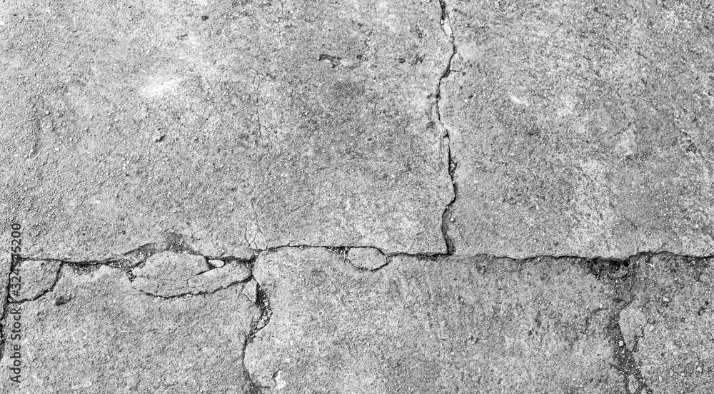 Obraz premium Black and white texture background floor of caraked cement garage.