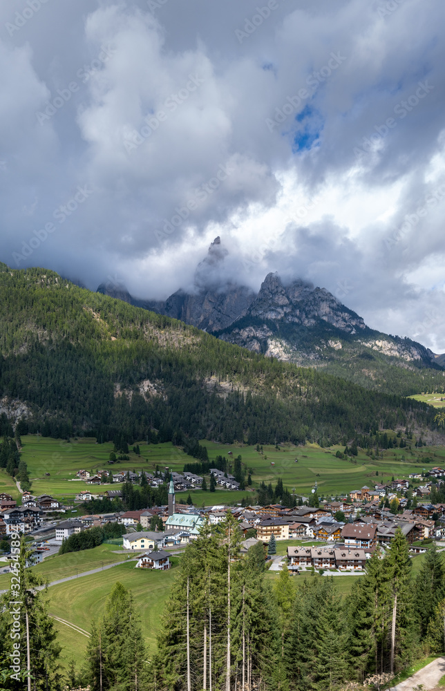 Large panoramic view of Pozza di Fassa, a commune in Trentino at the northern Italia