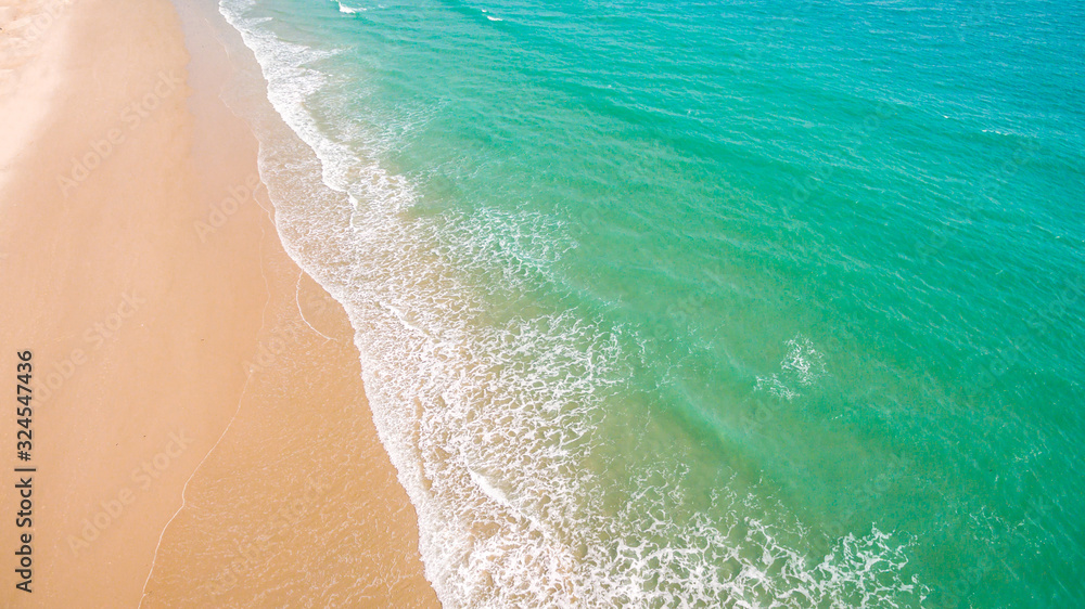 Top view aerial image from drone of an stunning beautiful sea landscape beach with turquoise water with copy space for your text.Beautiful Sand beach with turquoise water,aerial UAV drone shot