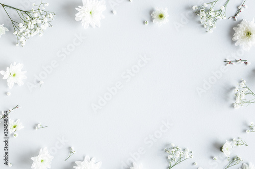 Flowers composition. White flowers on gray background. Spring concept. Flat lay, top view, copy space