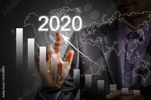 Luminous 2020 year numbers and network above man's hands at black background. New 2020 year technology concept.