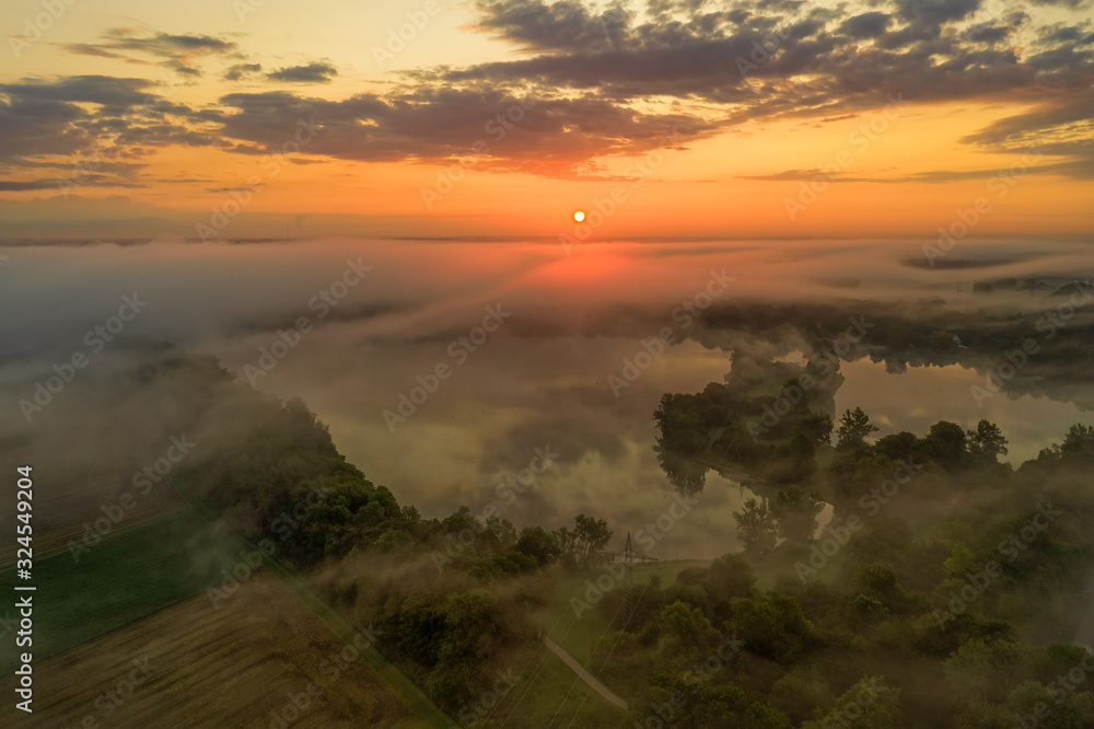 Impressive sunrise over a foggy lake, pure nature moment. Impressive sunrise over a foggy lake, pure nature moment.