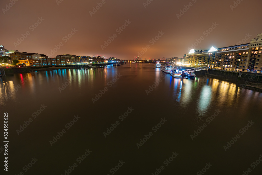 View of the Butler's Wharf at night from the Tower bridge, London, England, UK, GB