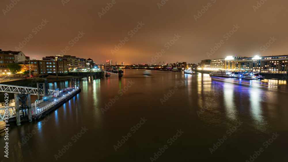 View of the Butler's Wharf at night from the Tower bridge, London, England, UK, GB