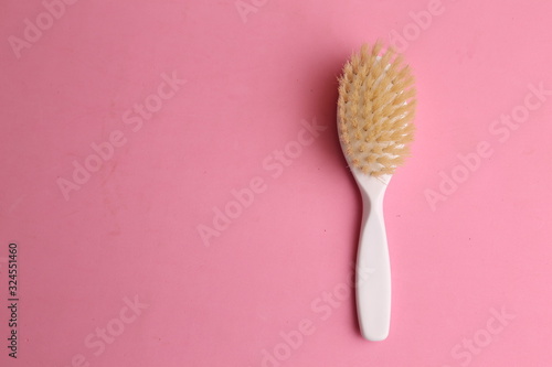 white hairbrush in color background