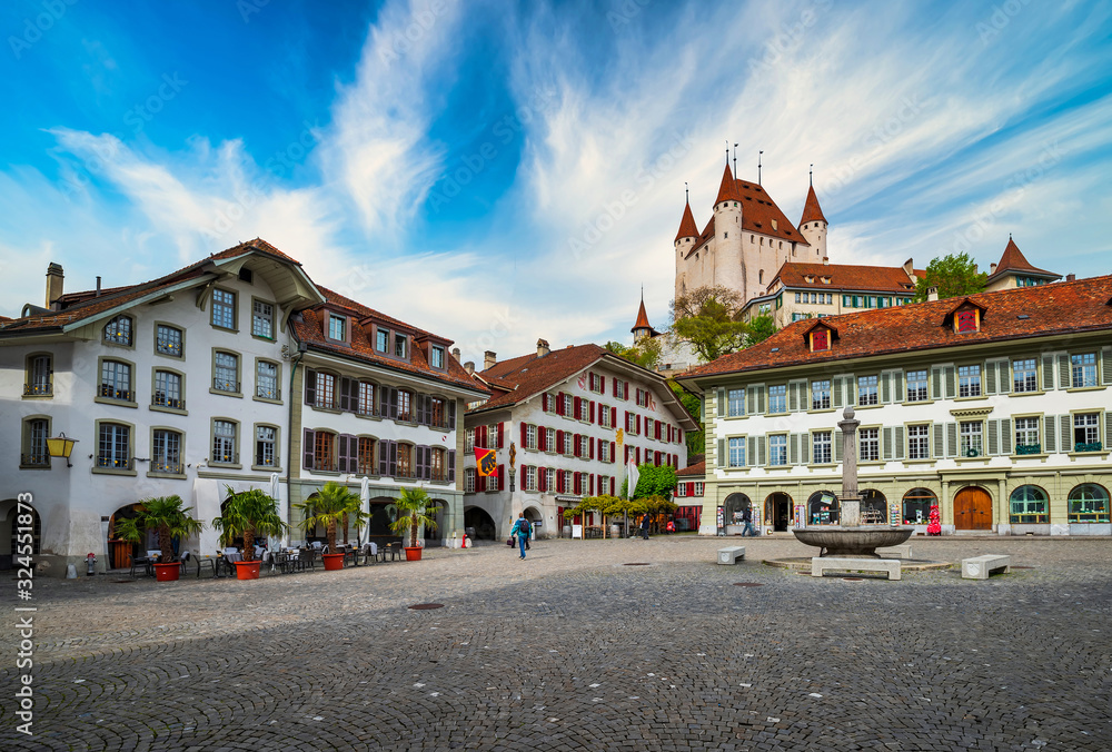 Amazing view of City Hall square and castle of Thun, Switzerland under picturesque sky