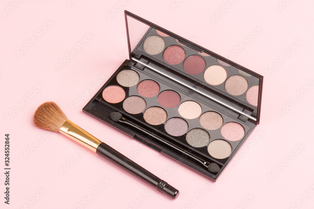 set of pastel eyeshadows isolated on rose background set of pastel eyeshadows isolated on rose background