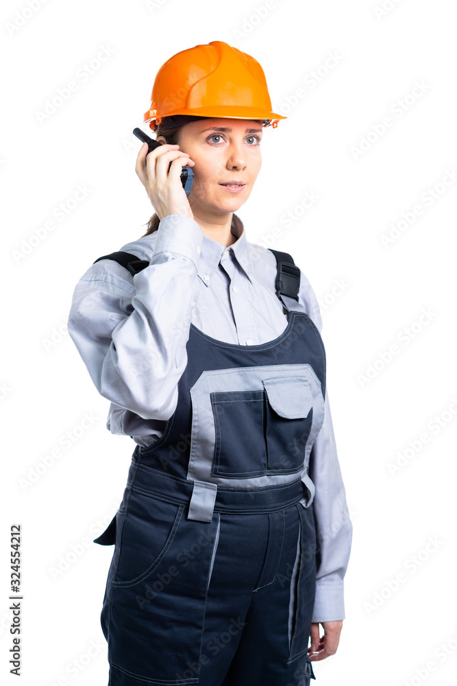 Girl builder talking on the walkie-talkie. isolated