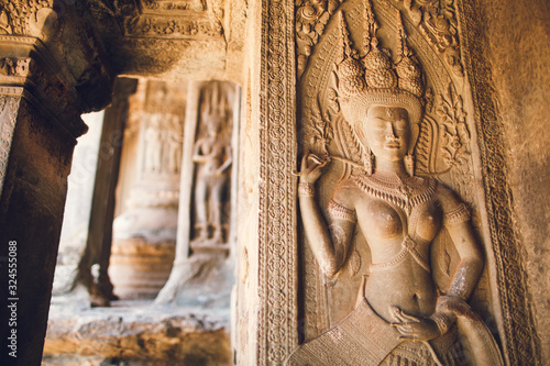 Walls decorated with wall carvings at Angkor Wat Temple. Siem Reap, Cambodia.