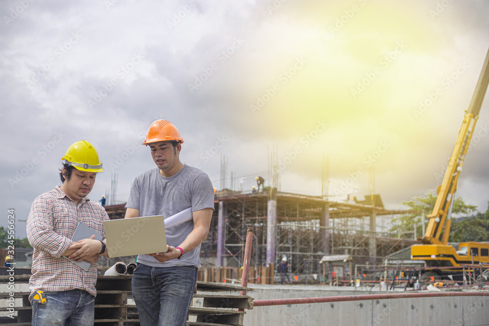 Two young man architect on a building construction site Two young man architect on a building construction site