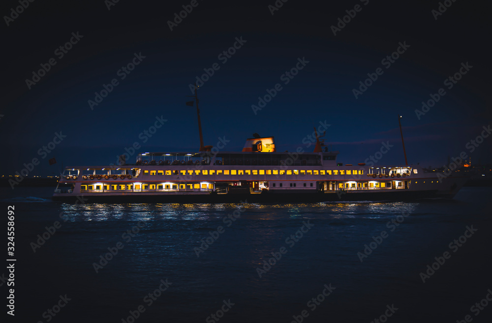 Istanbul City Ferry Sailing During Twilight With the Background of Hagia Shophia