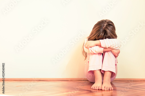 Sad and disappointed little girl. Emotion problems. Copy space