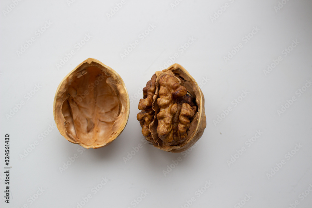 Walnut close - up isolated on a white background. Walnut close - up isolated on a white background.