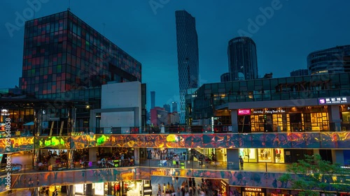 Big shopping area of Tai Koo Li in the center of Beijing in the evening. China. Time Lapse UHD 4k.