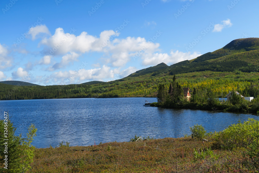Landscape with a house nearby a peaceful lake in Quebec Landscape with a house nearby a peaceful lake in Quebec