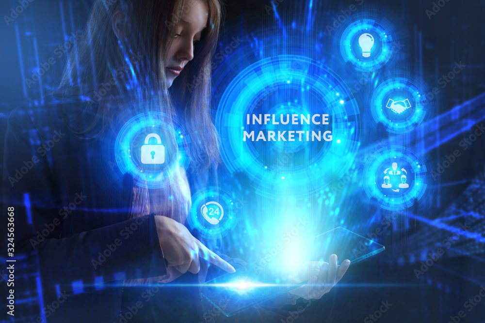 Business, Technology, Internet and network concept. Young businessman working on a virtual screen of the future and sees the inscription: Influence marketing Business, Technology, Internet and network concept. Young businessman working on a virtual screen of the future and sees the inscription: Influence marketing