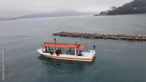 Boat used by oyster diving women in Mikimoto Pearl Island, Toba, Japan photo