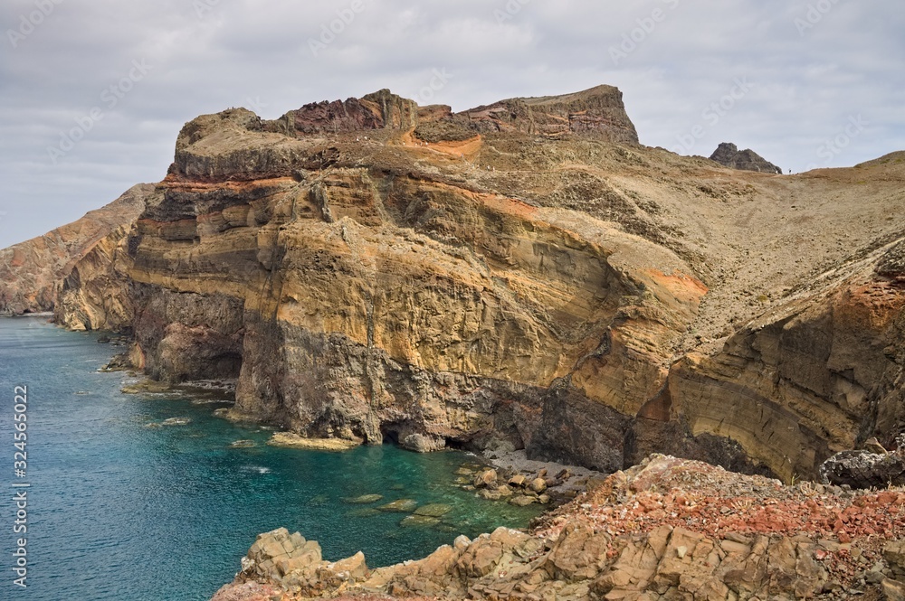 Colored geological rock layers of a cliff in Madeira (Portugal, Europe)