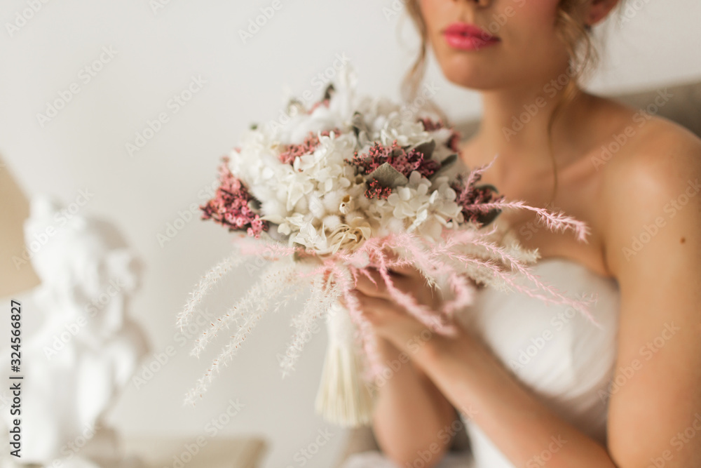 Wedding bouquet in hands of beautiful bride. Wedding concept. Wedding bouquet in hands of beautiful bride. Wedding concept.