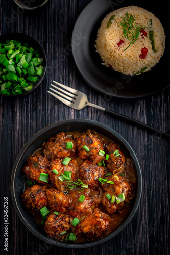 Veg manchurian with a bowl of fried rice  photo