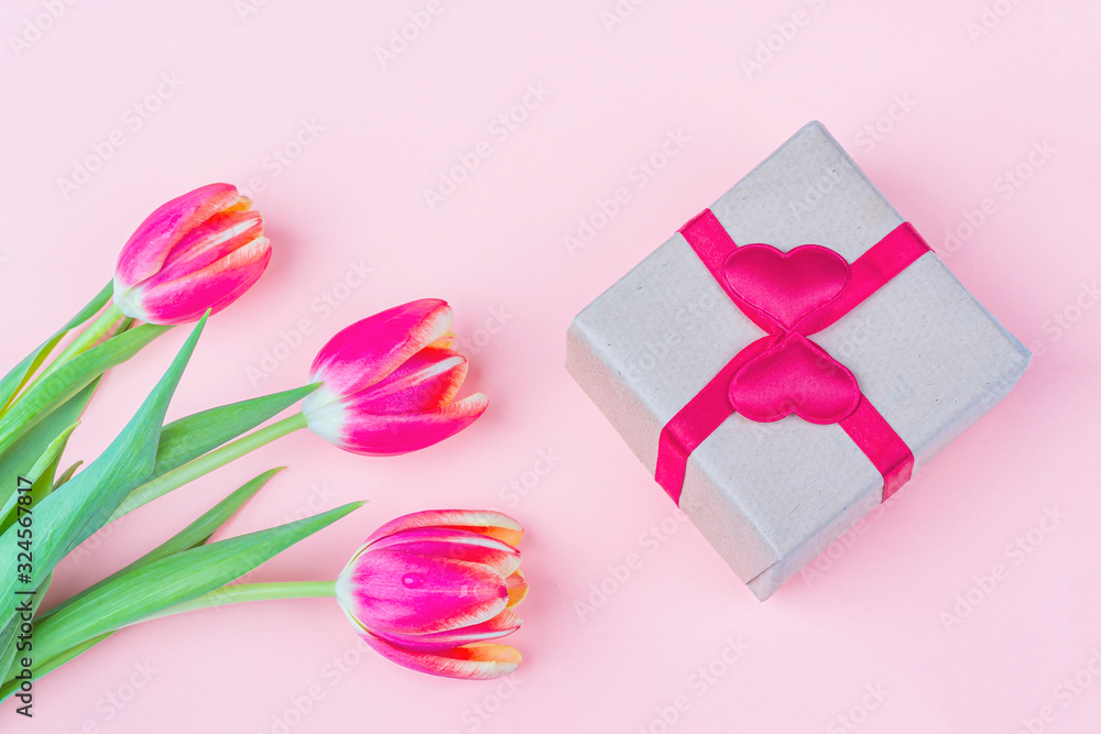 Bouquet of fresh red tulip flowers and giftbox on white background. Gift for a woman on holiday International Women's Day, Mother's, Valentine's day, birthday, anniversary and other events. Bouquet of fresh red tulip flowers and giftbox on white background. Gift for a woman on holiday International Women's Day, Mother's, Valentine's day, birthday, anniversary and other events.