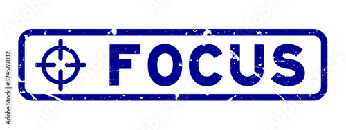 Grunge blue focus word with scope icon square rubber seal stamp on white background