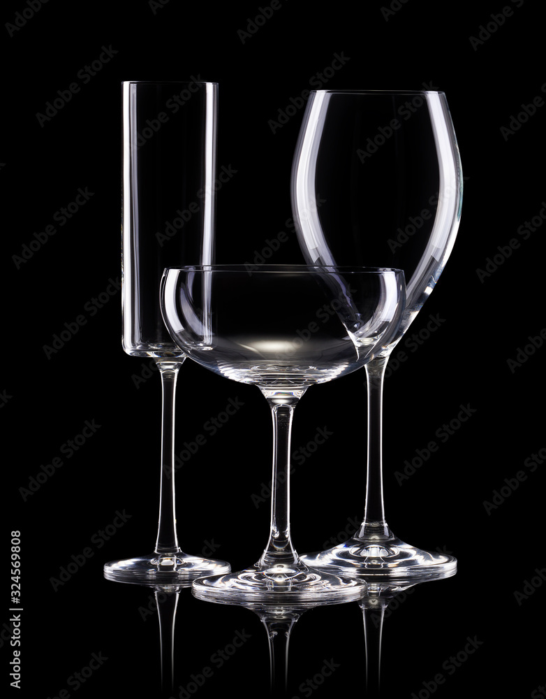 Set of different empty glasses for drinks on black background Set of different empty glasses for drinks on black background