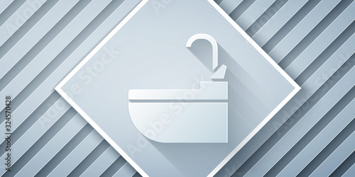 Paper cut Washbasin with water tap icon isolated on grey background. Paper art style. Vector Illustration