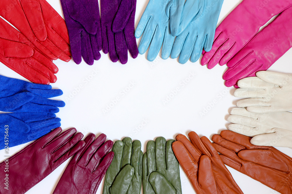 Collection of colorful bright fashionable gloves on a white background.Accessory for hands.