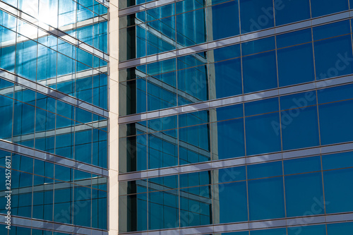 Reflection on modern glass and steel building