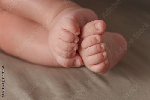 Close up of the tiny legs of a sleeping baby