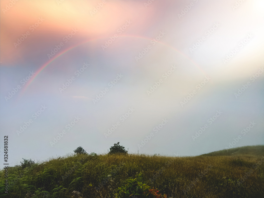 Naklejka premium The beautiful hill on the top of the hill and the bright light in the sky