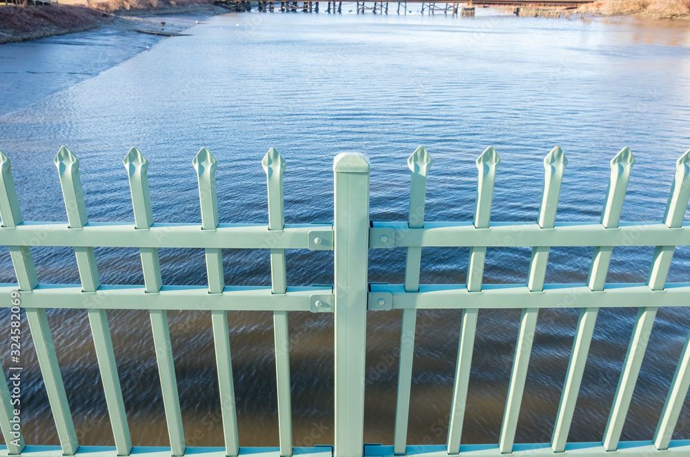 Isolated steel hand rail with lake river water background. 