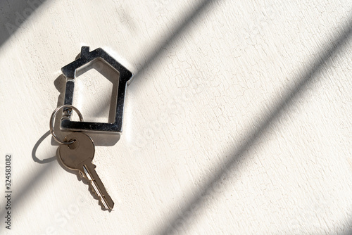 House keys on white background with shadows photo