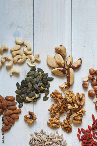 Different types of nuts, seeds, goji, divided in groups