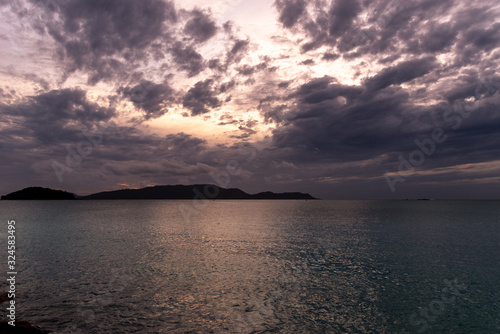 Sunrise over seychelles islands.  First beams of light